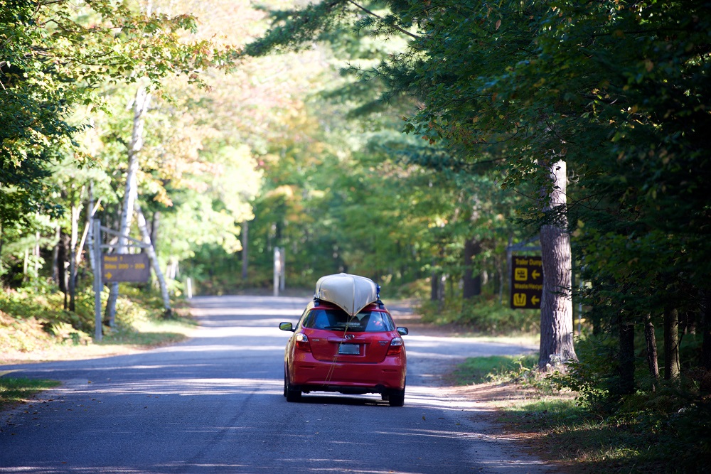 car with canoe on roof