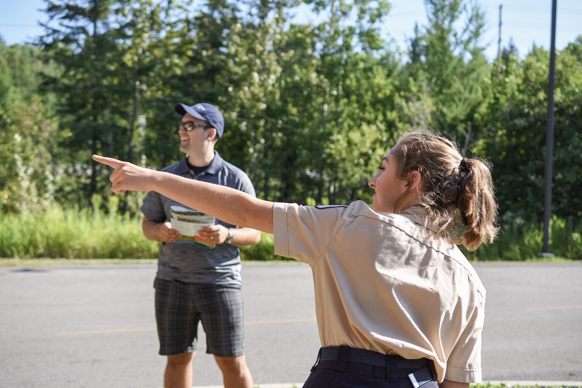 Employee providing directions to a customer.