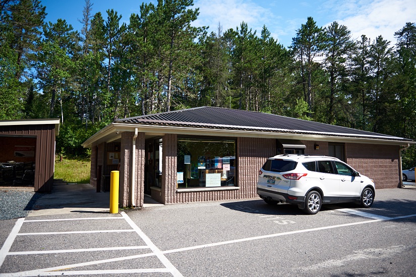 Car parked outside main gate.