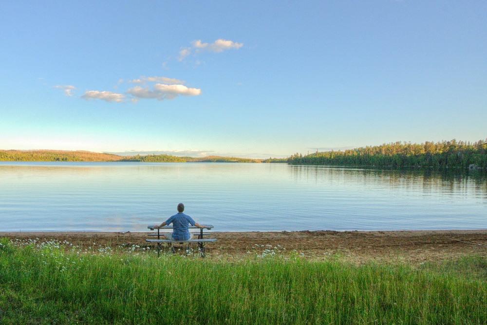 person sitting at picnic table