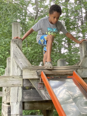 child on play structure