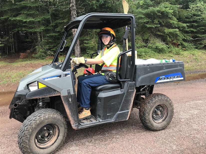 Maintenance worker in a UTV.