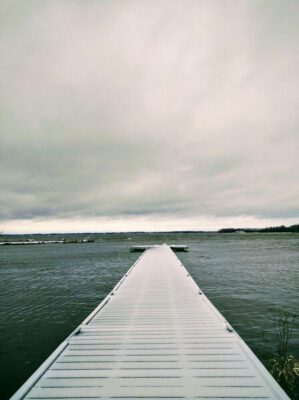 Dock on lake covered in snow