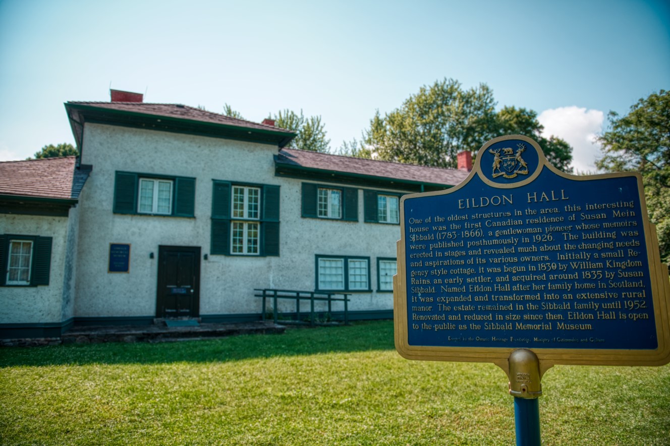 White building with historical plaque