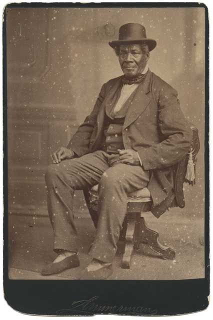 black and white portrait of man sitting