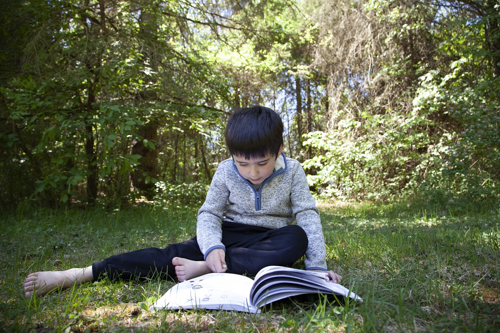 child reading book