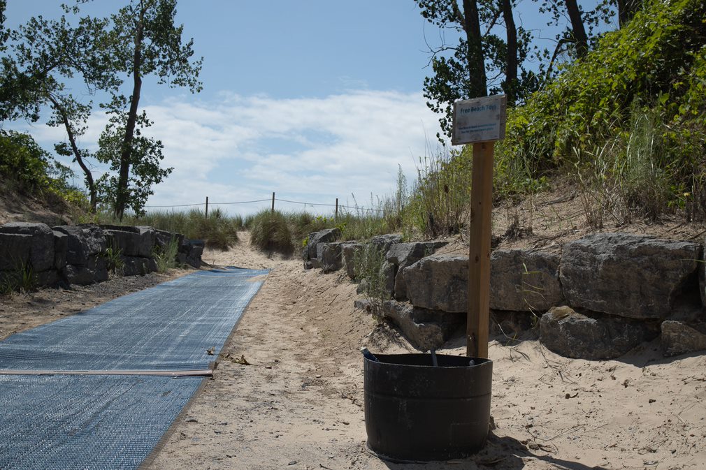 mobi mat on top on sandy trail to beach