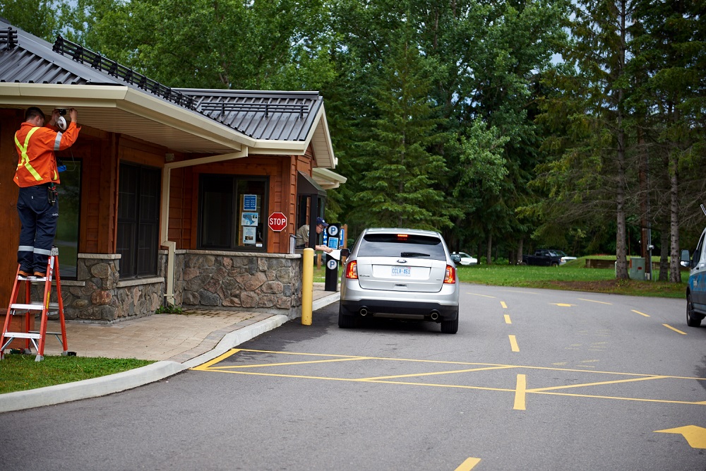 car stopped at gatehouse window