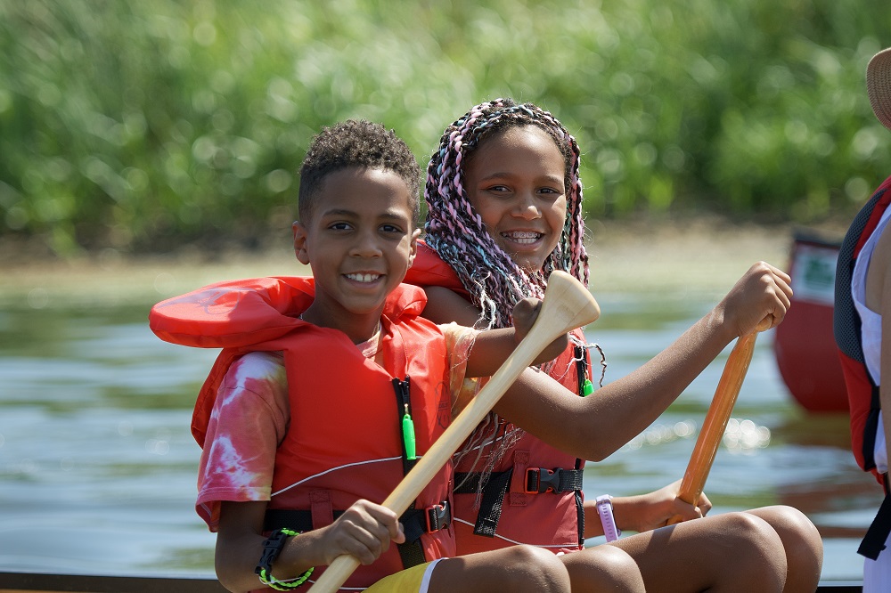 Family canoeing on lake 