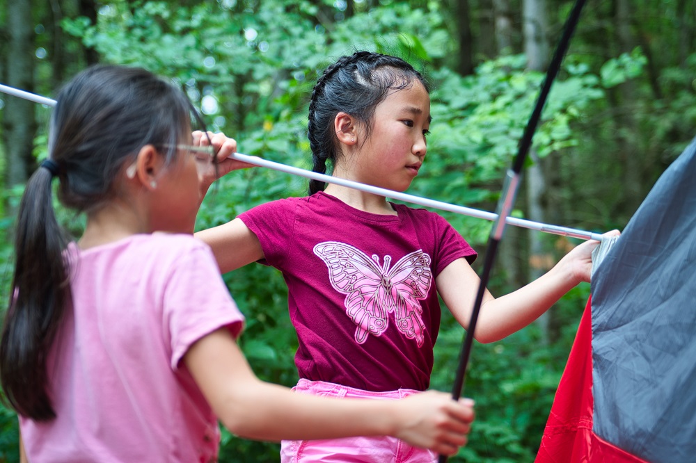 Children setting up tent