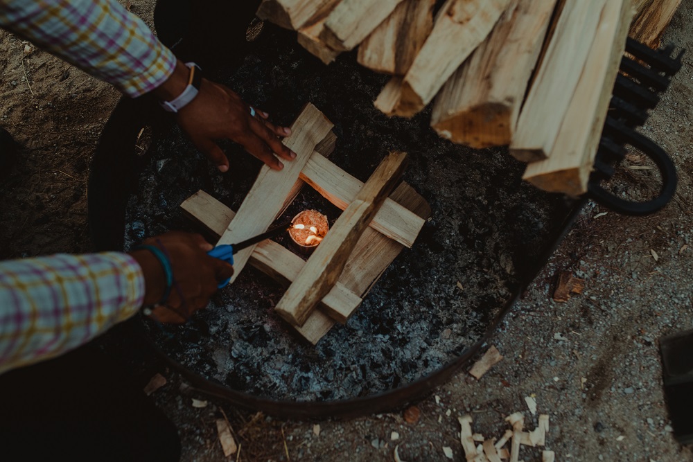 Woman lighting a fire 