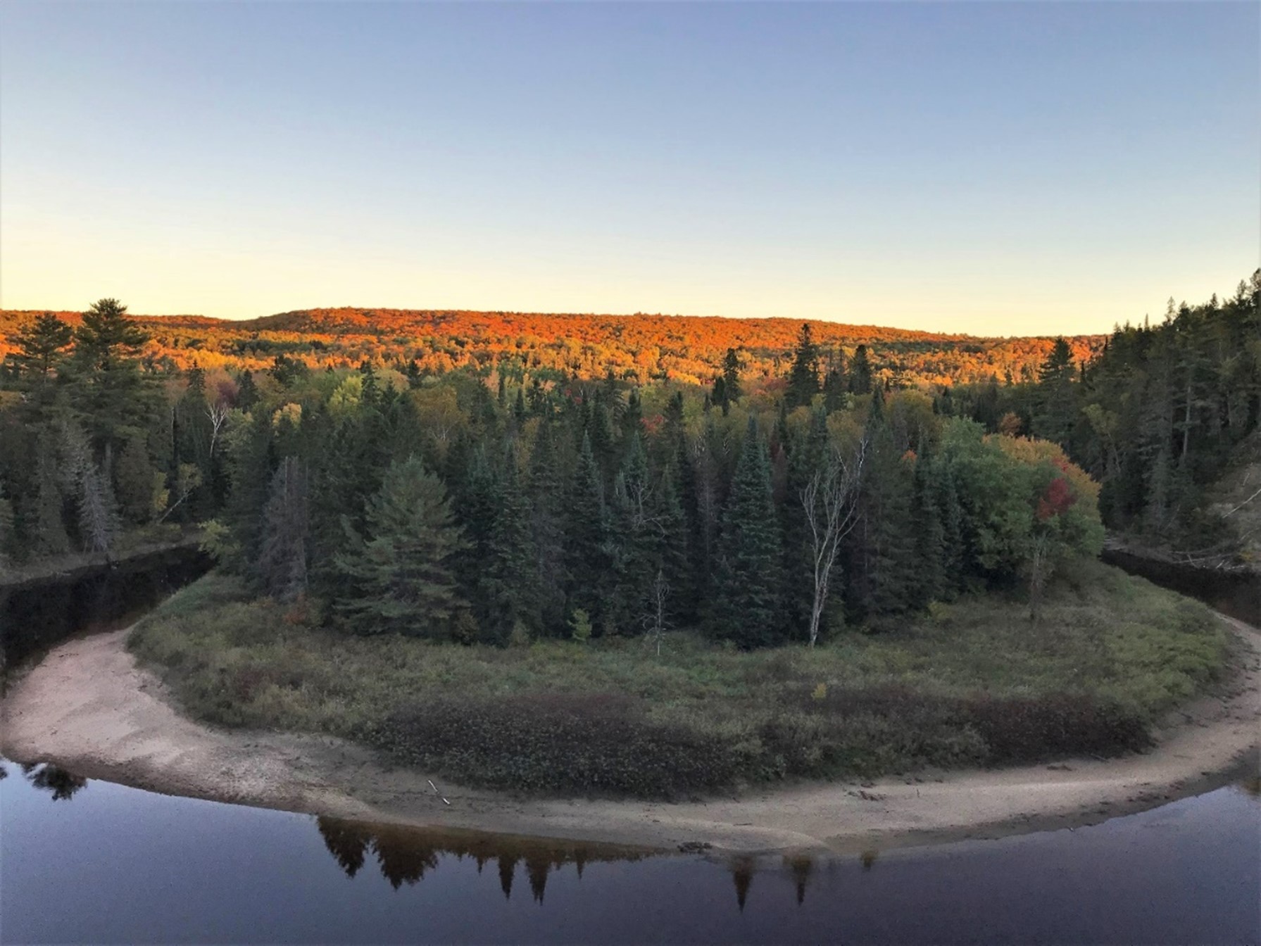 view of geological feature with fall colours in background 