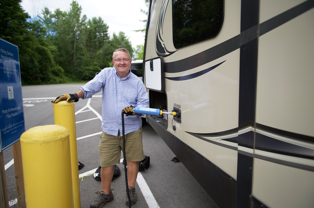 person filling trailer