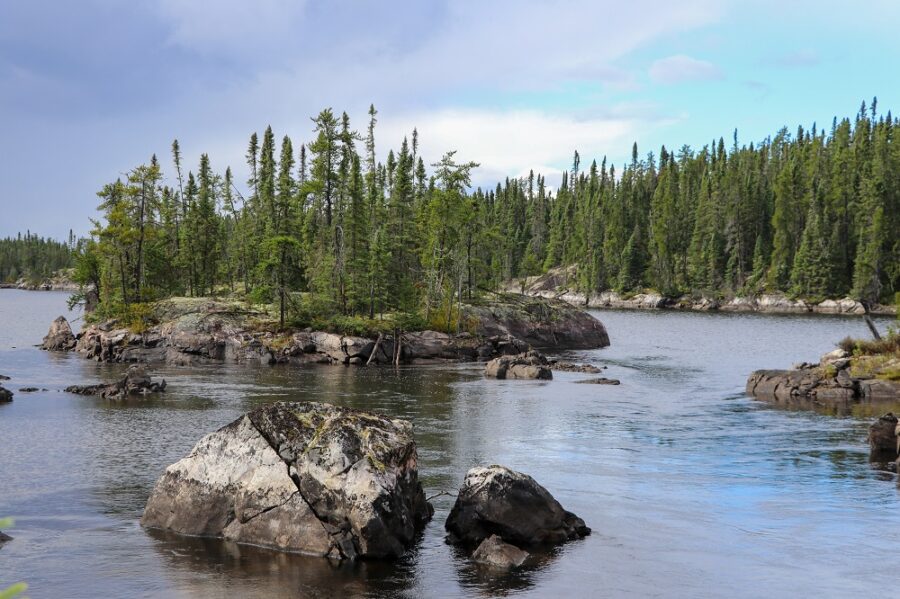 boulders in river in northern forest