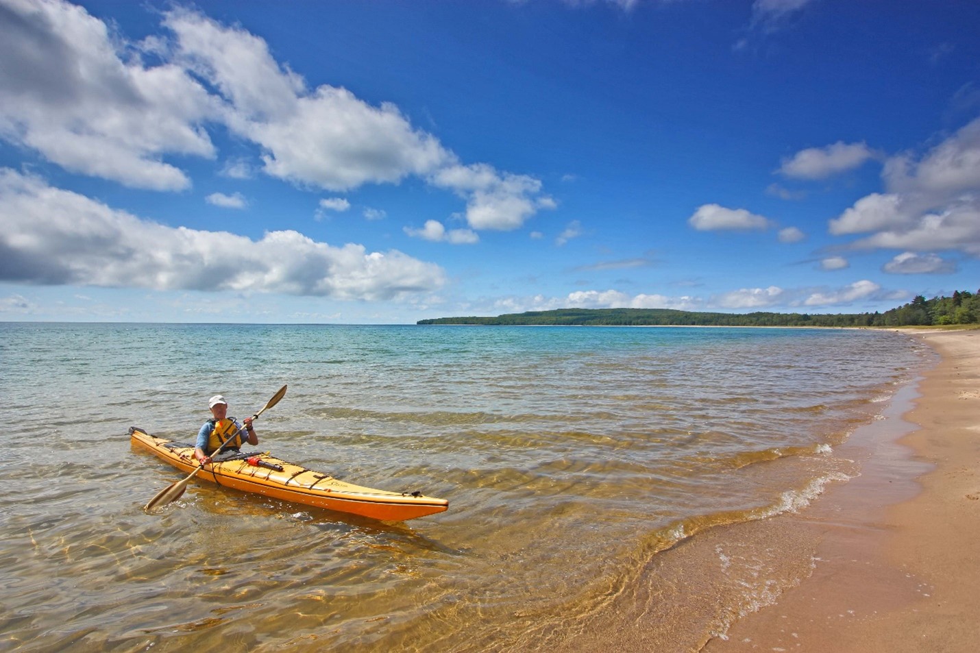 person kayaking in water