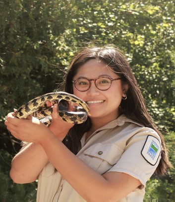 staff holding snake