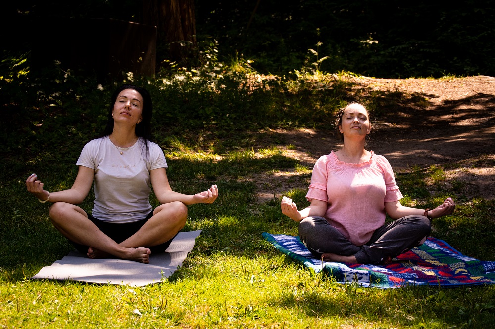 two people doing yoga