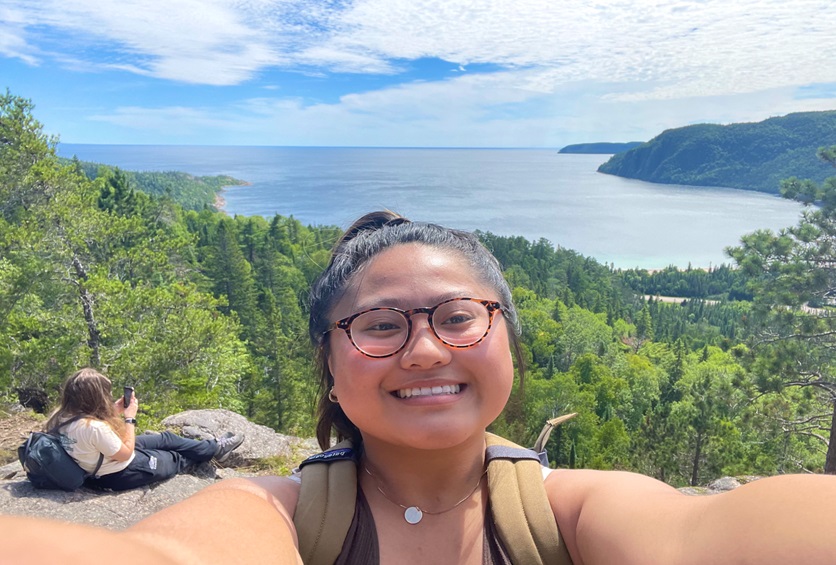 Alysa taking a selfie of her and Zuzanna on a lookout near Old Woman Bay on Lake Superior