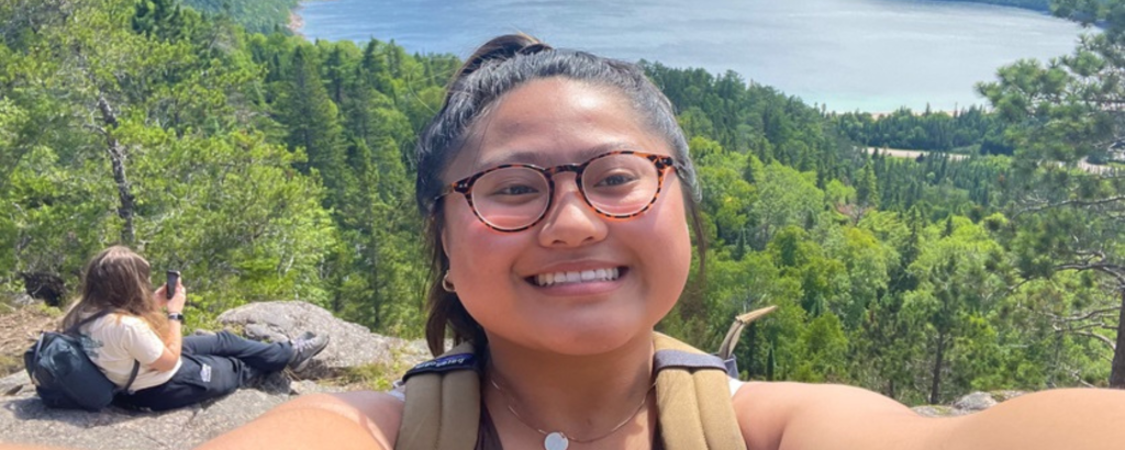 Alysa taking a selfie of her and Zuzanna on a lookout near Old Woman Bay on Lake Superior
