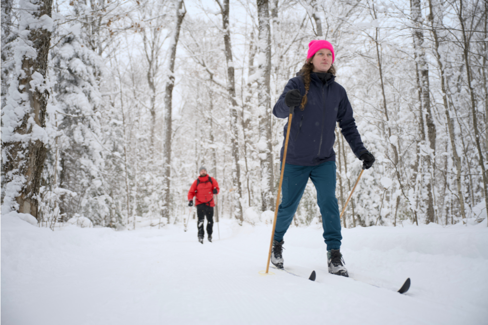 two skiers on snowy forest trail at Algonquin