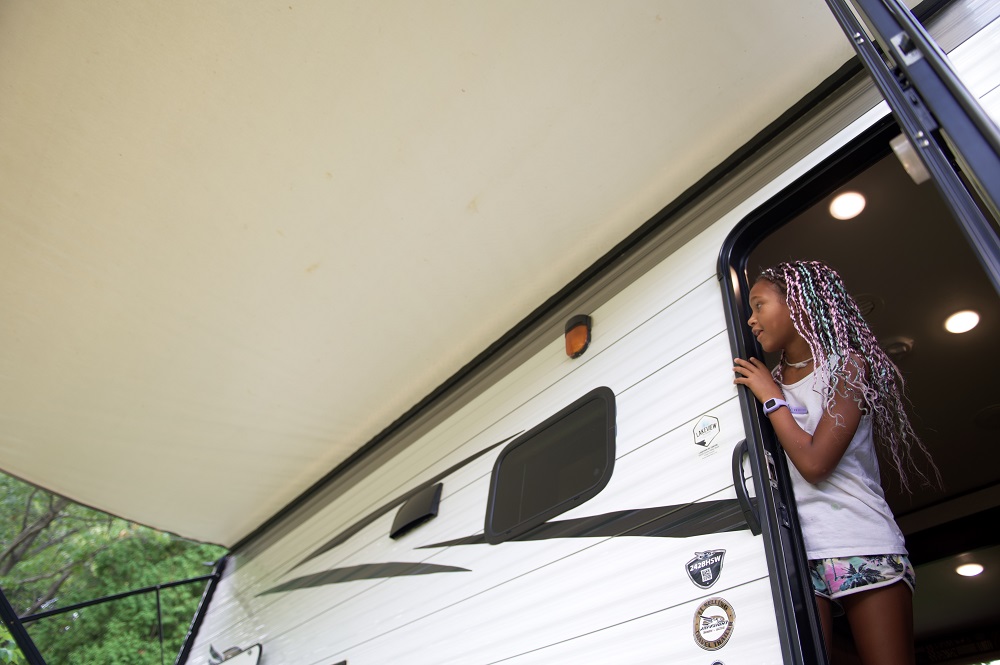 child stepping out of RV