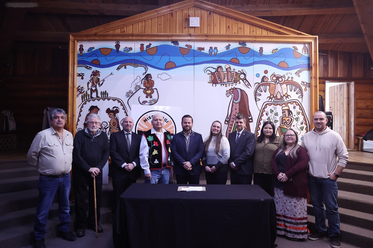 Photo of representatives in front of a table at the ceremony