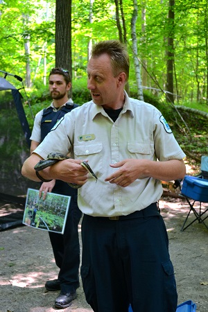 staff holding snake