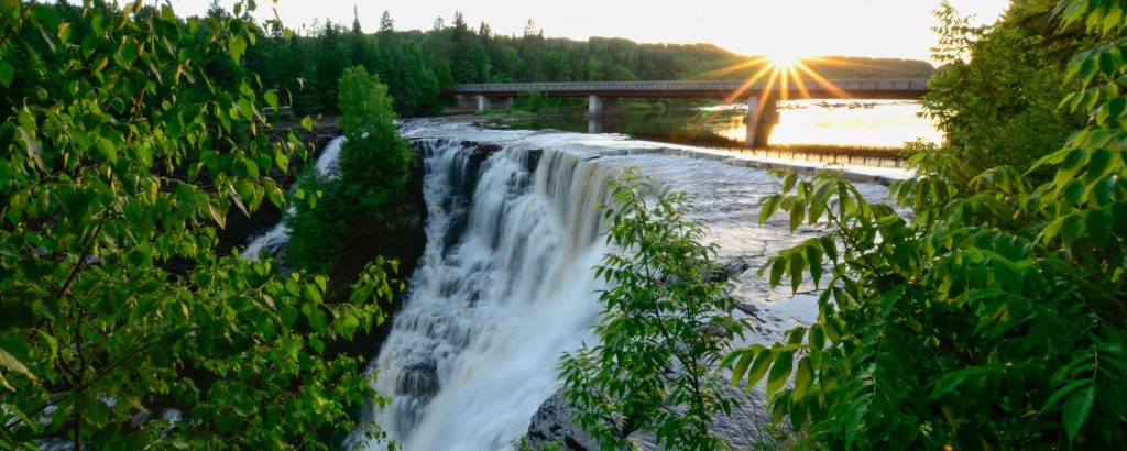 sun shining over falls