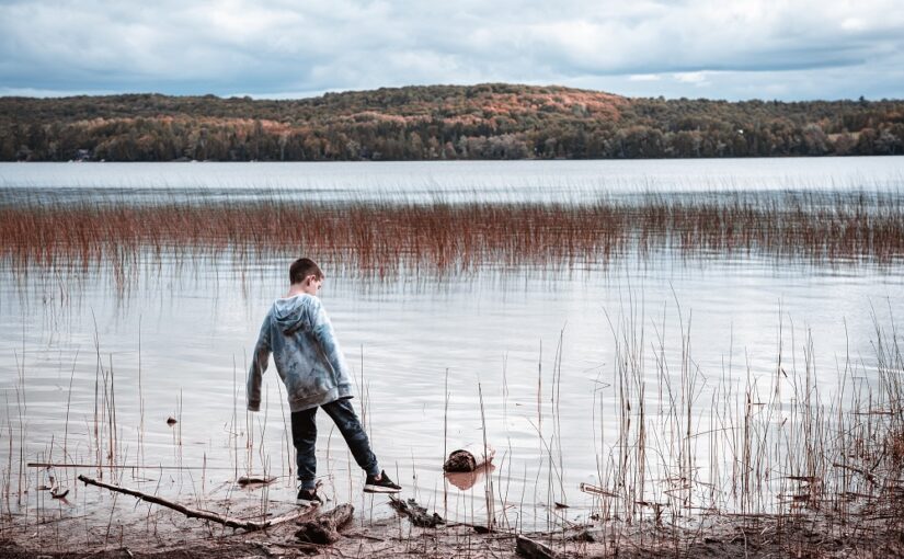 Child Exploring shoreline