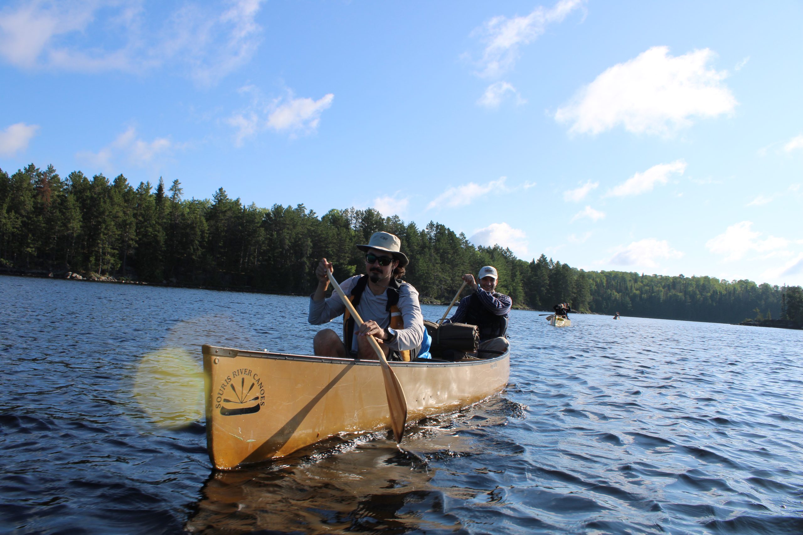 People canoeing on a lake in Quetico Provincial Park