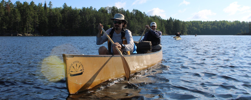 People canoeing on a lake in Quetico Provincial Park