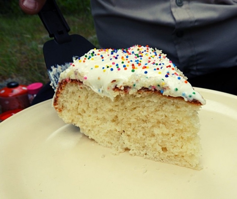 sliced birthday cake on plate