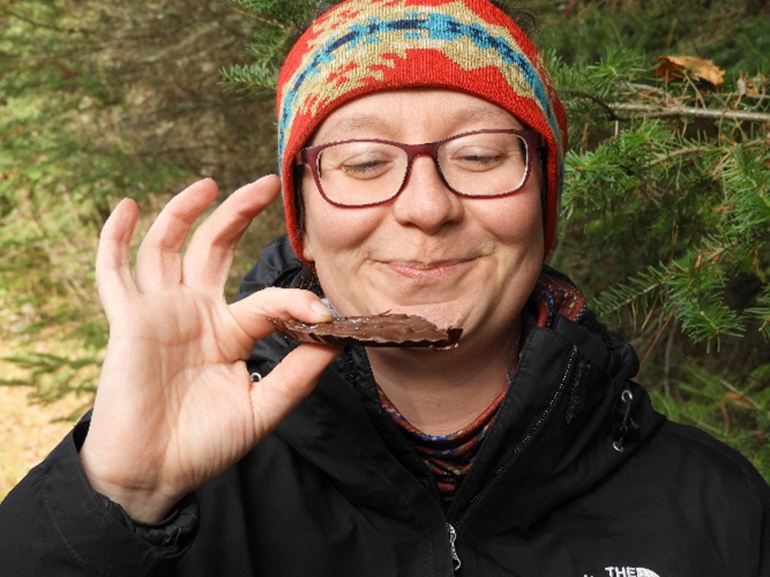 woman holding piece of fudge