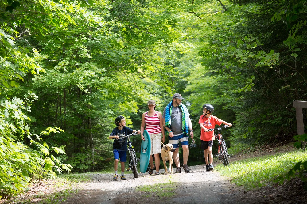 family walking on park road