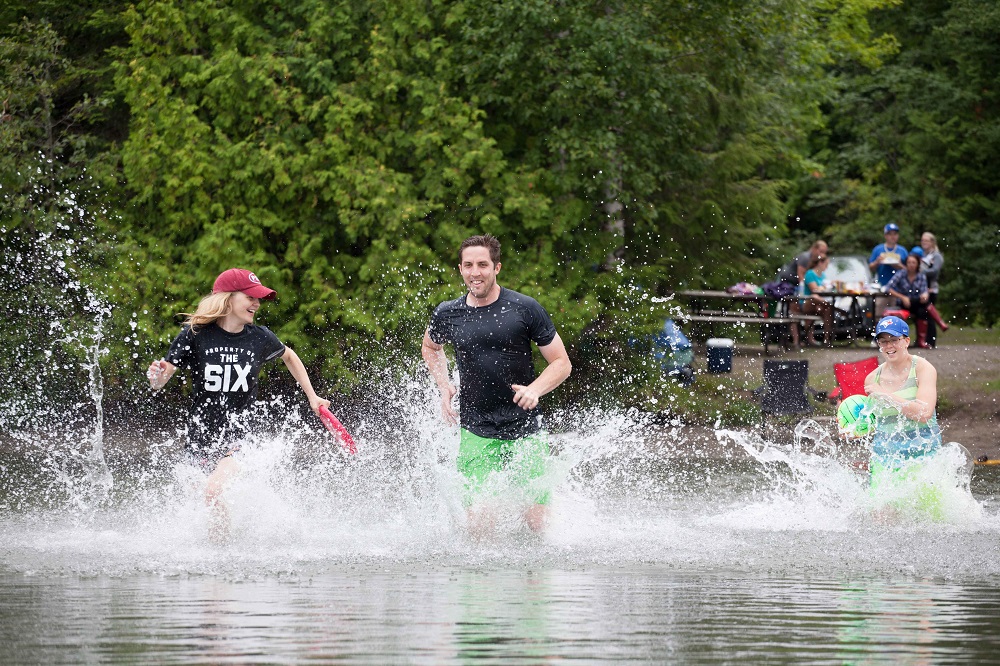 group running into water