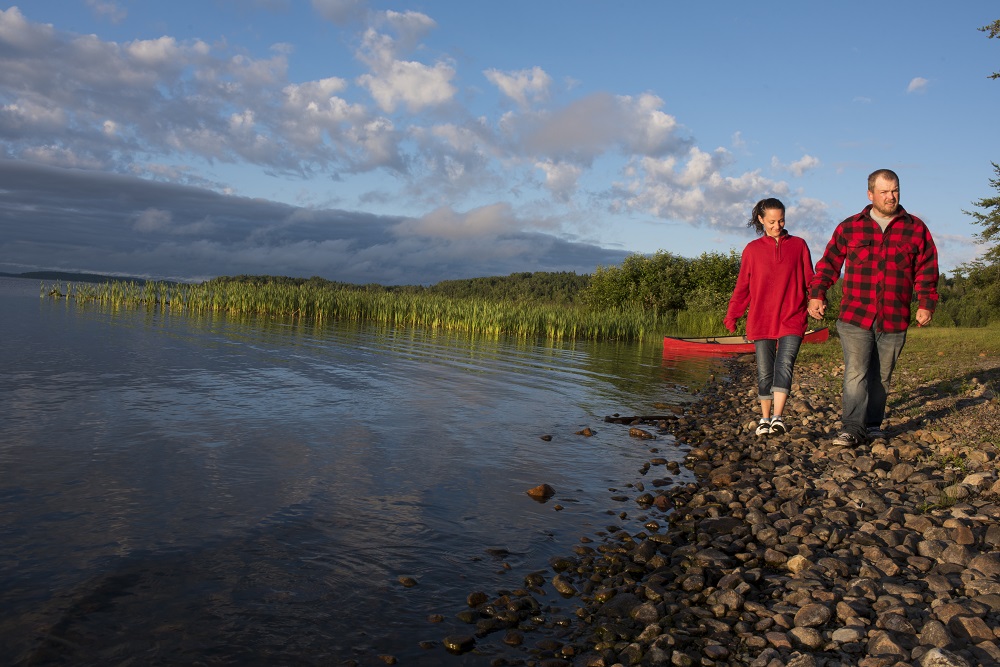 couple walking along shoreline