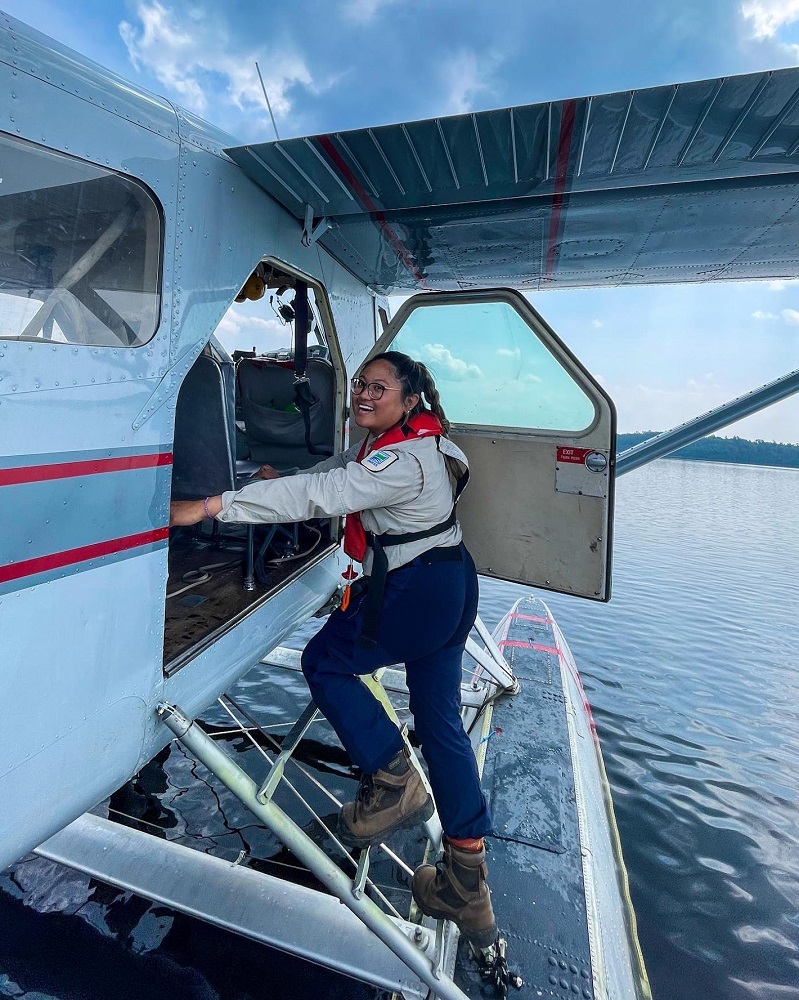 staff walking onto float plane