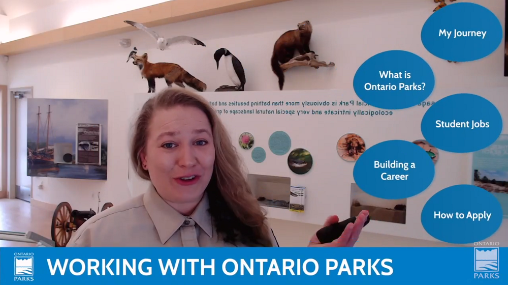 staff pointing towards graphics on screen, listed as: My Journey, What is Ontario Parks, Student Jobs, Building a Career, How to Apply