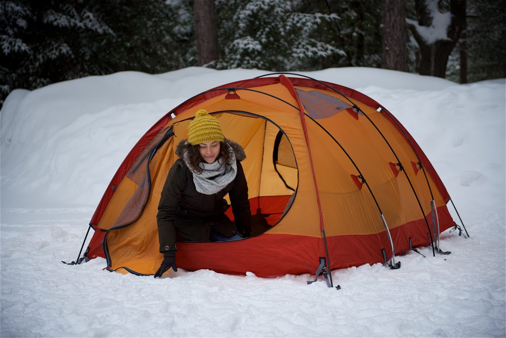 person getting out of tent