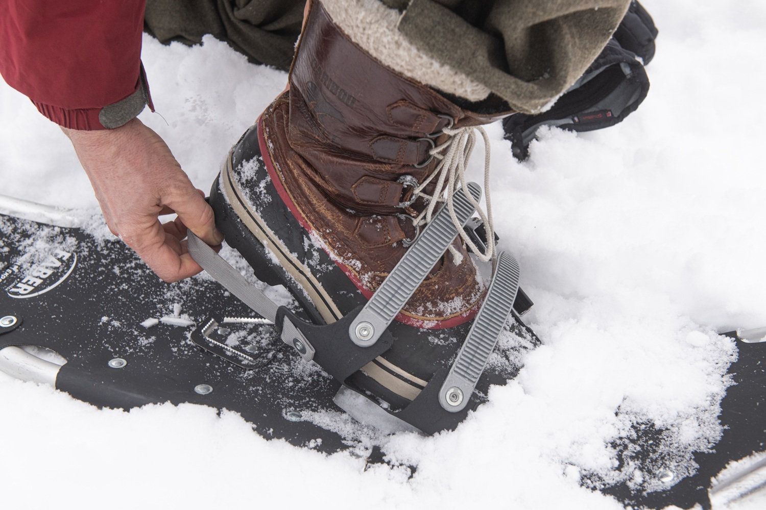 Une botte glissant dans une raquette