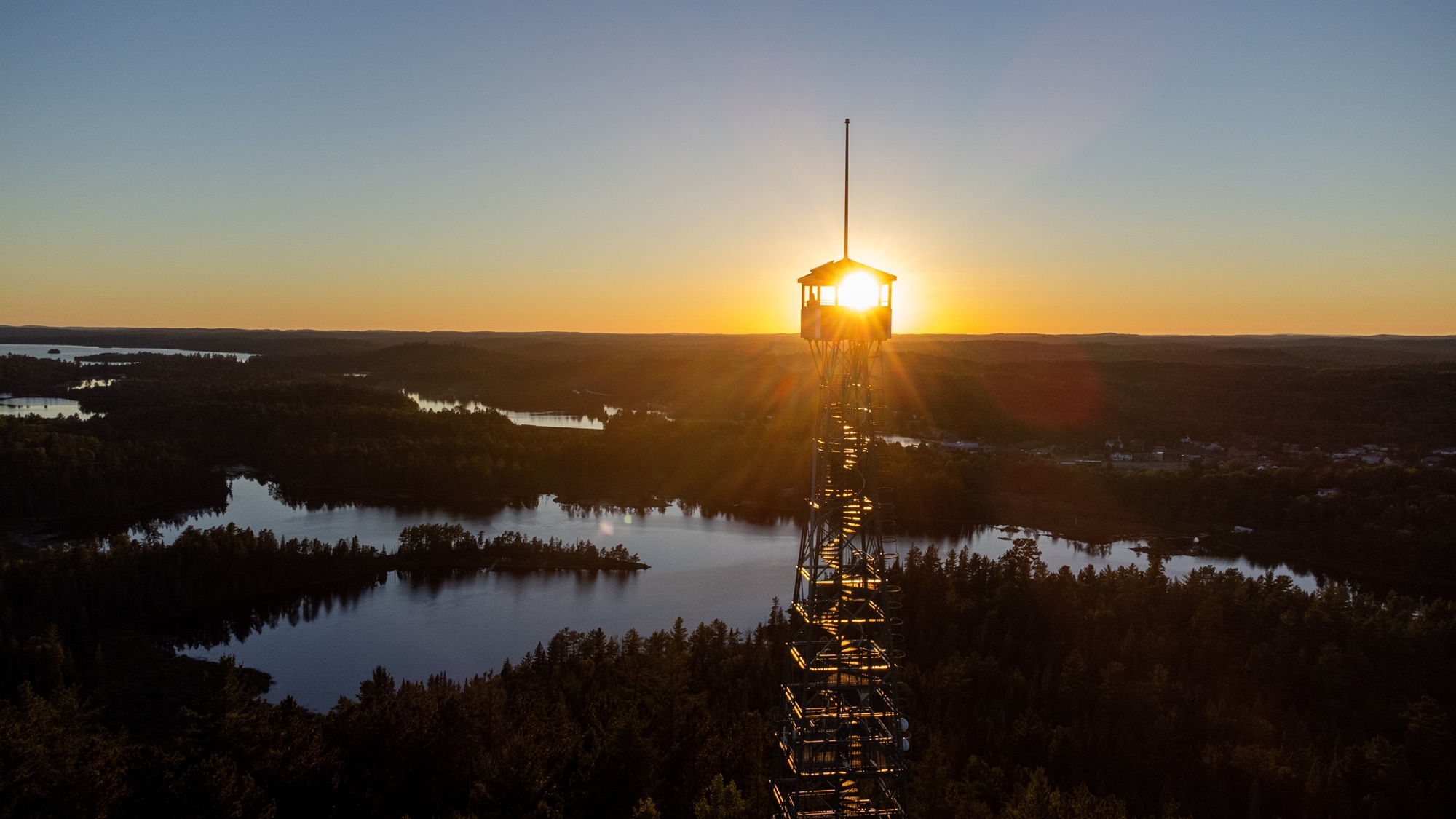 Firetower over forest at dusk