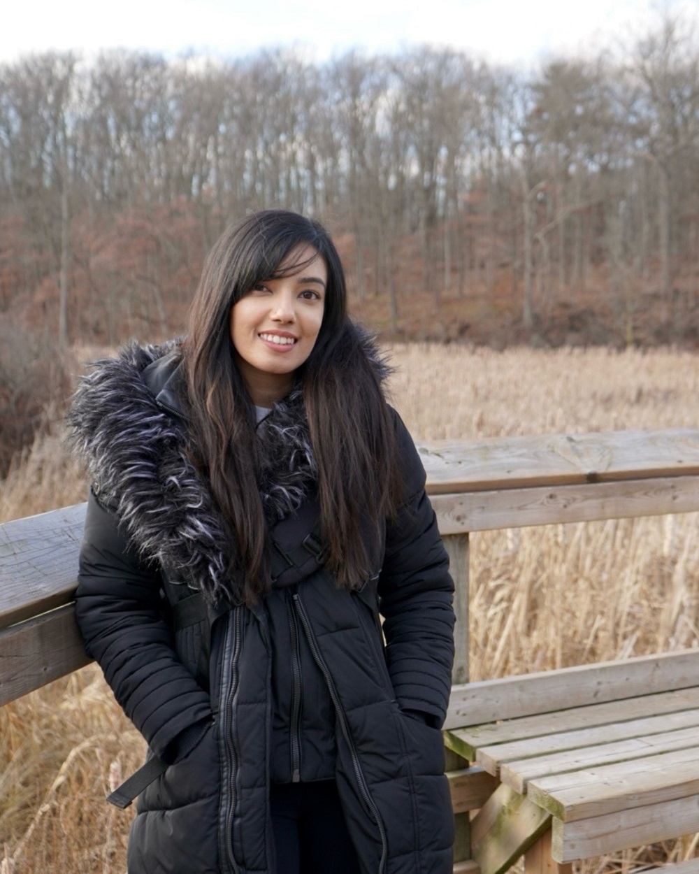 woman in winter jacket standing outside