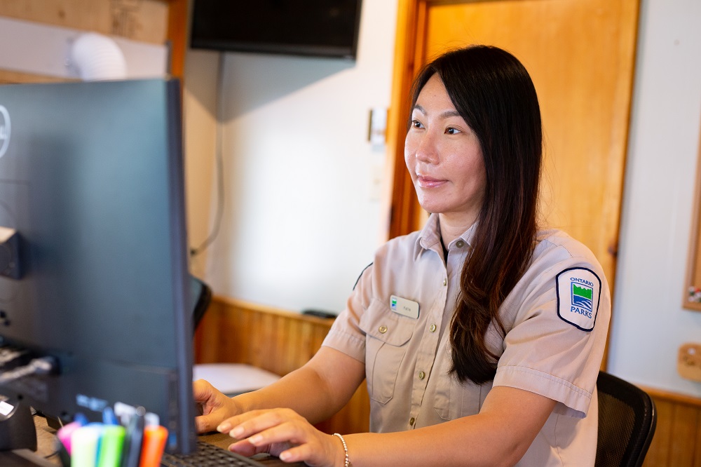 gate staff working at computer