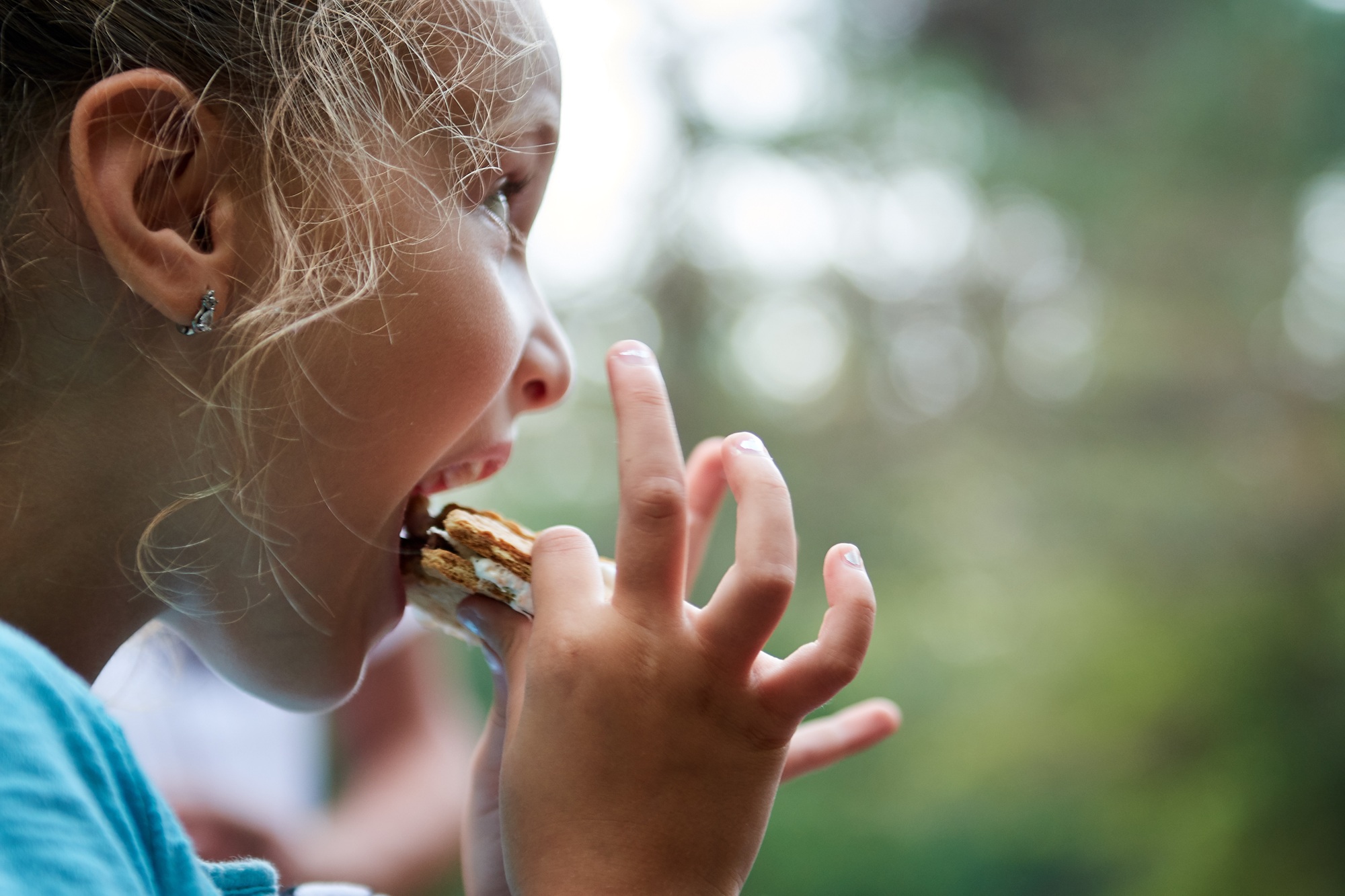 child eating s'mores