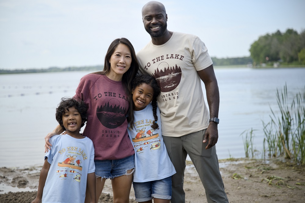 family standing together wearing merchandise