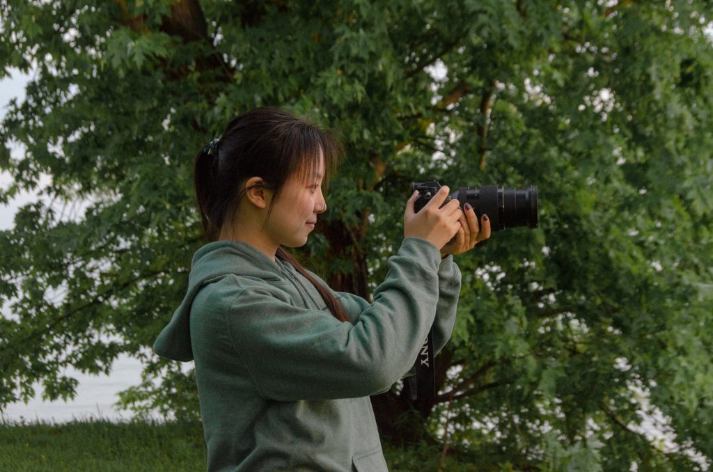 person looking through camera