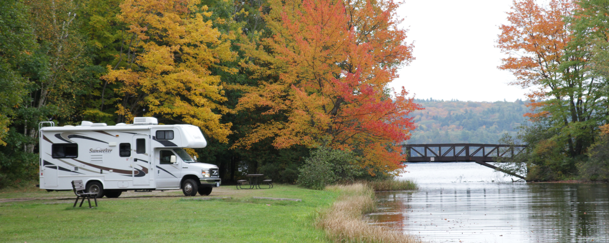 RV parked amongst fall colours at Bon Echo.