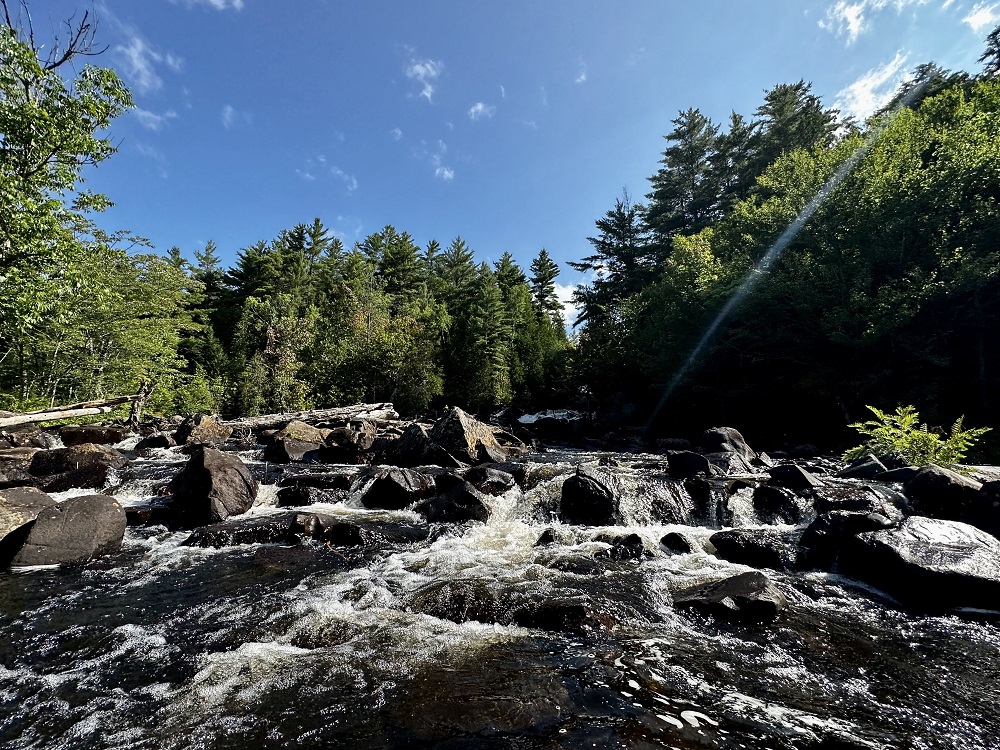 base of waterfall through rocks