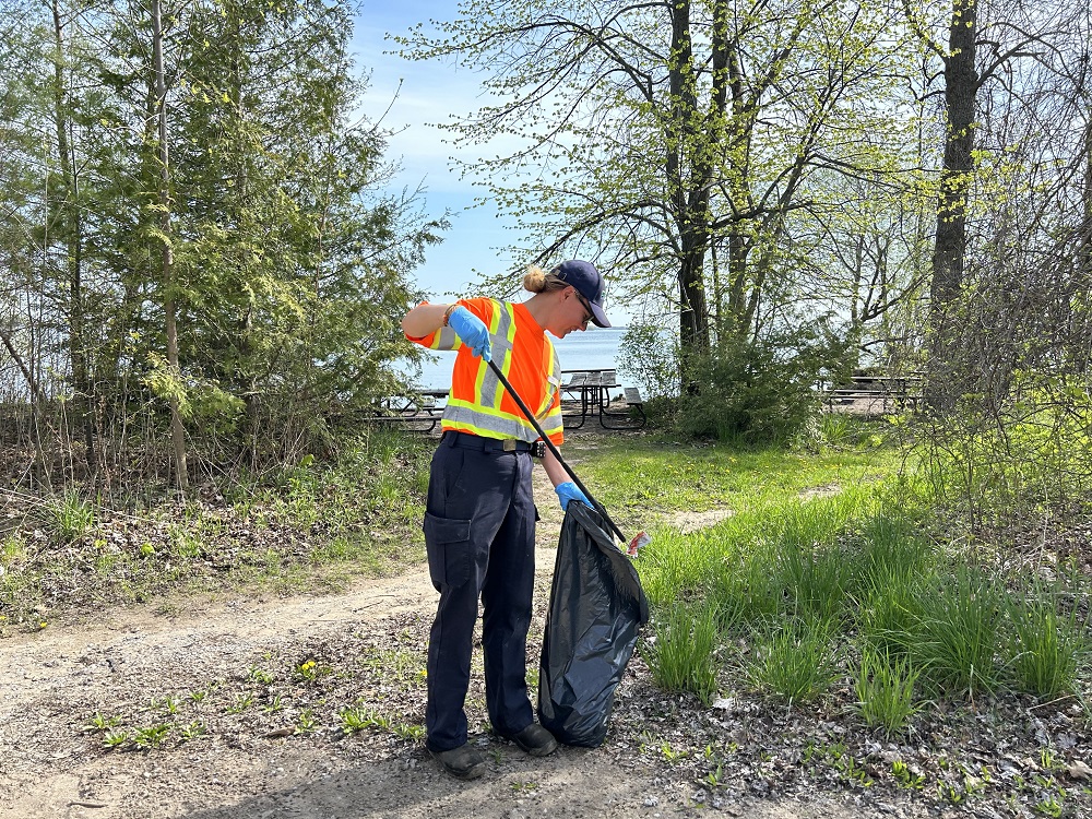 staff picking up garbage