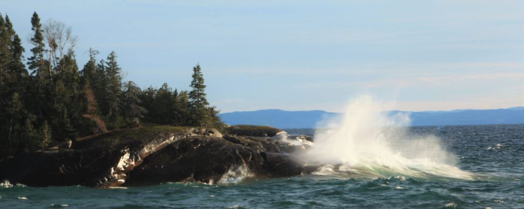 waves crashing against rocky shore